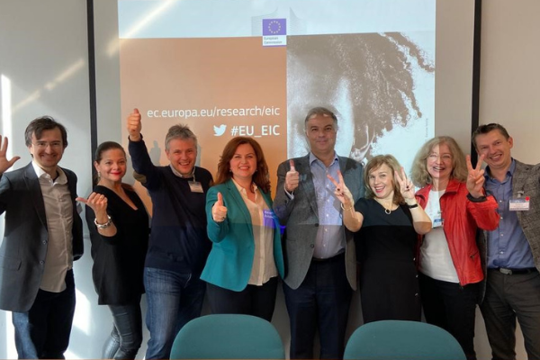 EIC jury members in front of a screen showing thumbs up