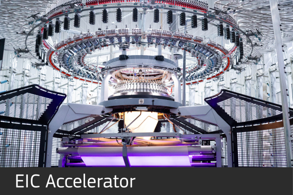 Smartex: Open Circular Knitting Machine with purple light
